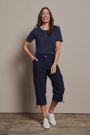Model Amanda wearing size 10 of The Everyday Cropped Cargo Pant in colour Darknavy (Blue), from the front, showing the whole outfit
