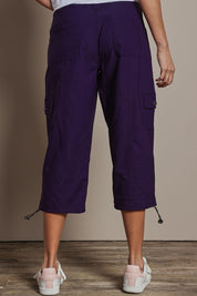 Model Amanda wearing size 10 of The Everyday Cropped Cargo Pant in colour Grape (Purple), from the back