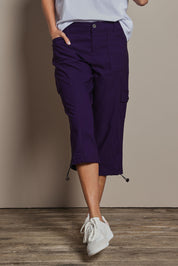 Model Amanda wearing size 10 of The Everyday Cropped Cargo Pant in colour Grape (Purple), from the front, cropped image