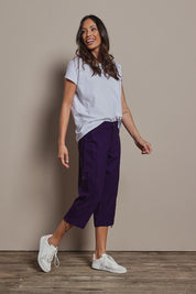 Model Amanda wearing size 10 of The Everyday Cropped Cargo Pant in colour Grape (Purple), from the front, showing the whole outfit