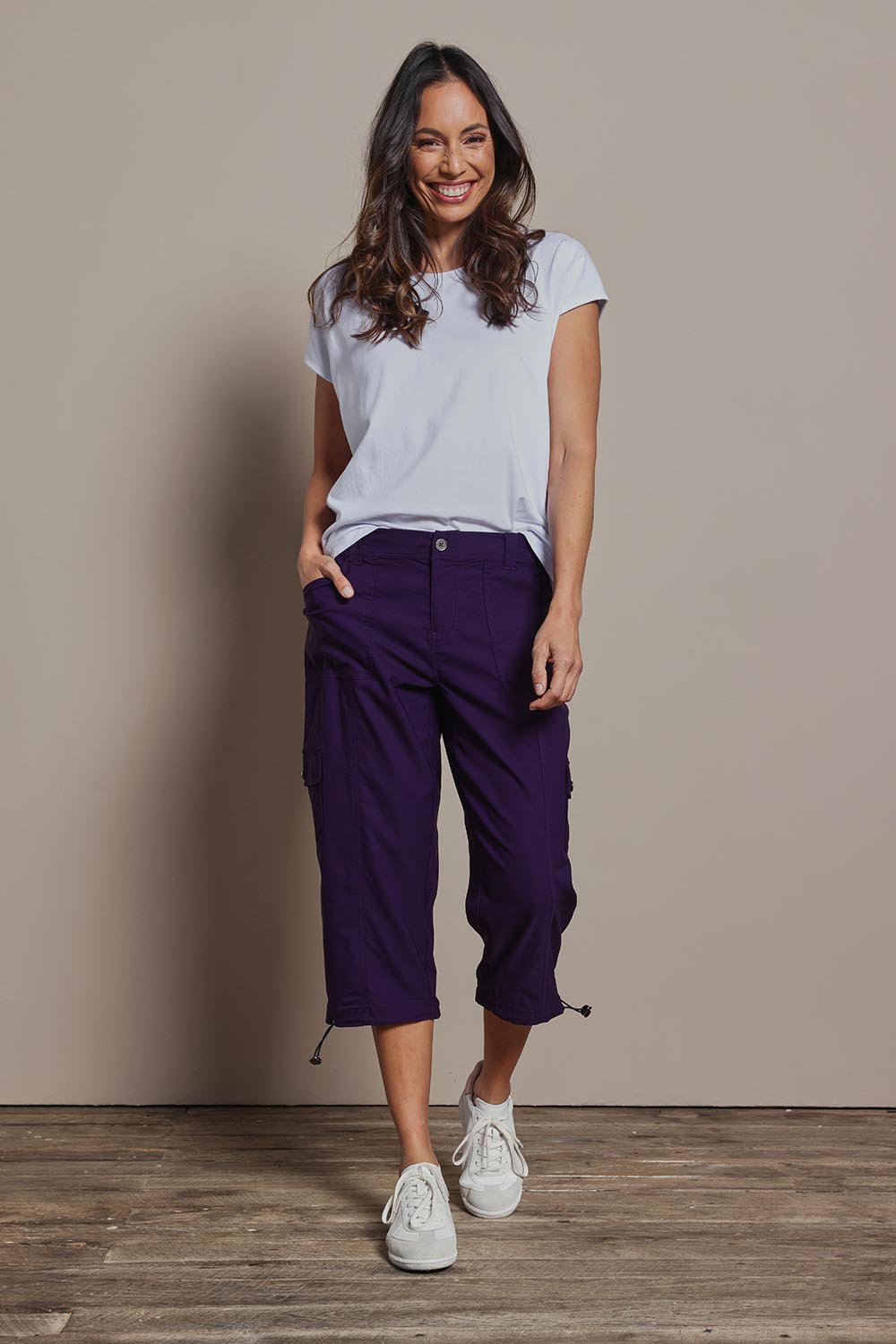Model Amanda wearing size 10 of The Everyday Cropped Cargo Pant in colour Grape (Purple), from the front, showing the whole outfit