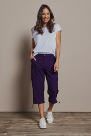 Model Amanda wearing size 10 of The Everyday Cropped Cargo Pant in colour Grape (Purple), from the front, showing the whole outfit
