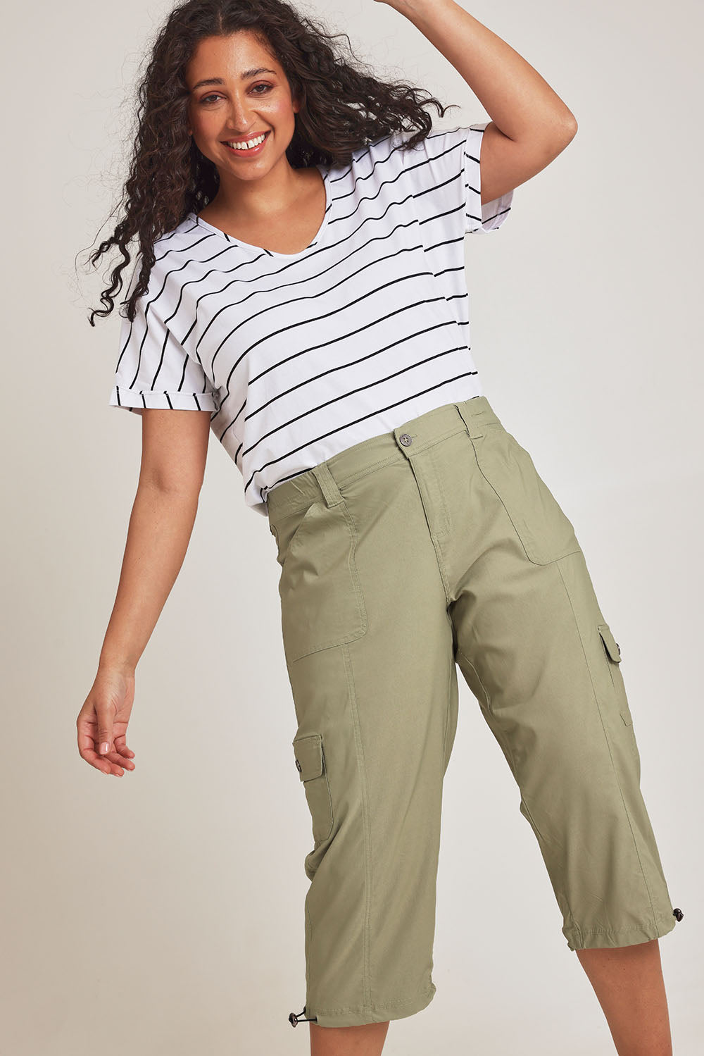 Model Terri-Leigh wearing size 14 of The Everyday Cropped Cargo Pant in colour Khaki (Green), from the front, cropped image