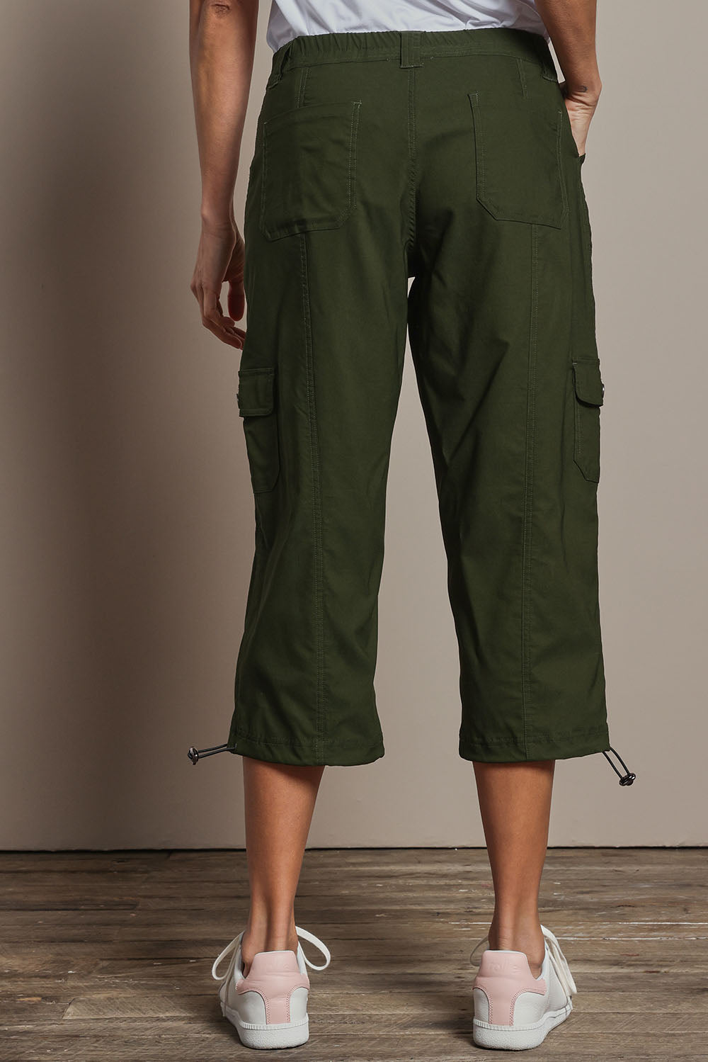 Model Amanda wearing size 10 of The Everyday Cropped Cargo Pant in colour Olive (Green), from the back