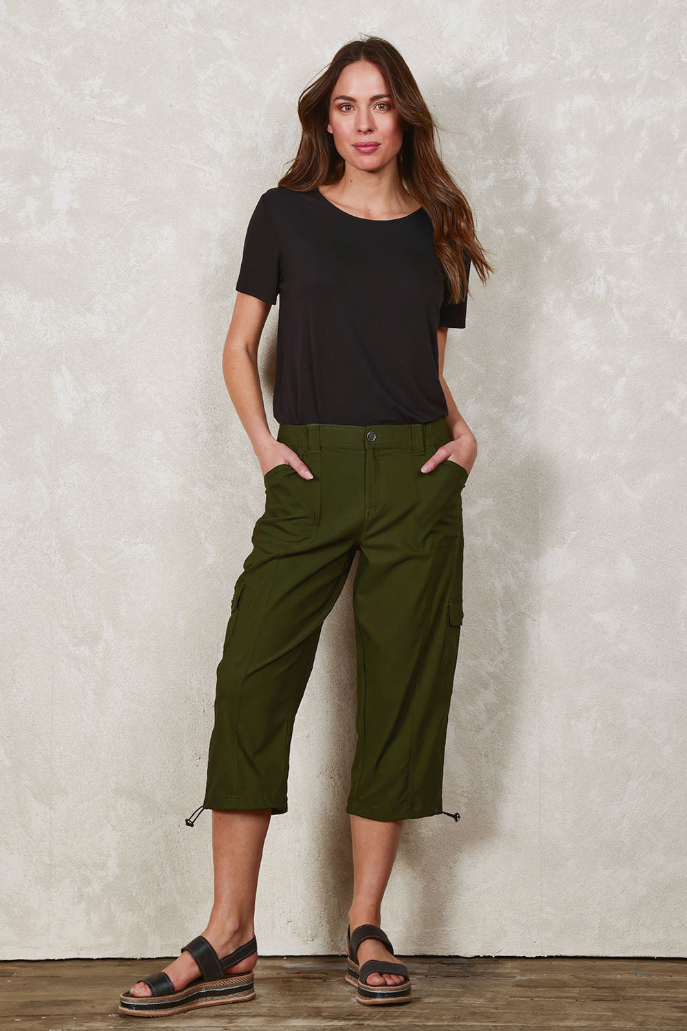 Model Madeline wearing size 10 of The Everyday Cropped Cargo Pant in colour Olive (Green), from the front, showing the whole outfit