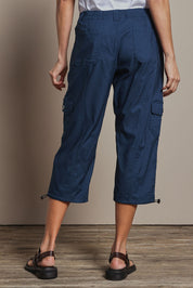 Model Amanda wearing size 10 of The Everyday Cropped Cargo Pant in colour Petrol (Blue), from the back