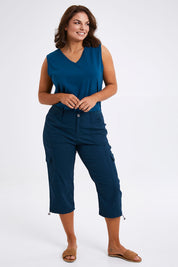 Model Monique wearing size 14 of The Everyday Cropped Cargo Pant in colour Petrol (Blue), from the front, showing the whole outfit