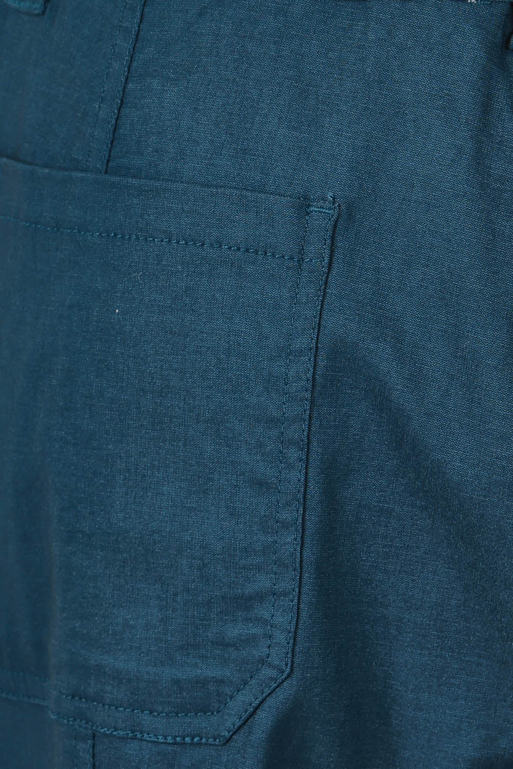Product shot of The Everyday Cropped Cargo Pant in colour Petrol (Blue), detail