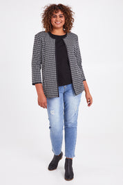 Model Anucia wearing size 14 of The Edge To Edge Ponte Print Jacket in colour Blackwhite (Black), from the front, showing the whole outfit