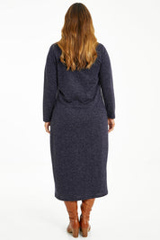 Model Laura wearing size 14 of The High Neck Maxi Dress in colour Navymarle (Blue), from the back
