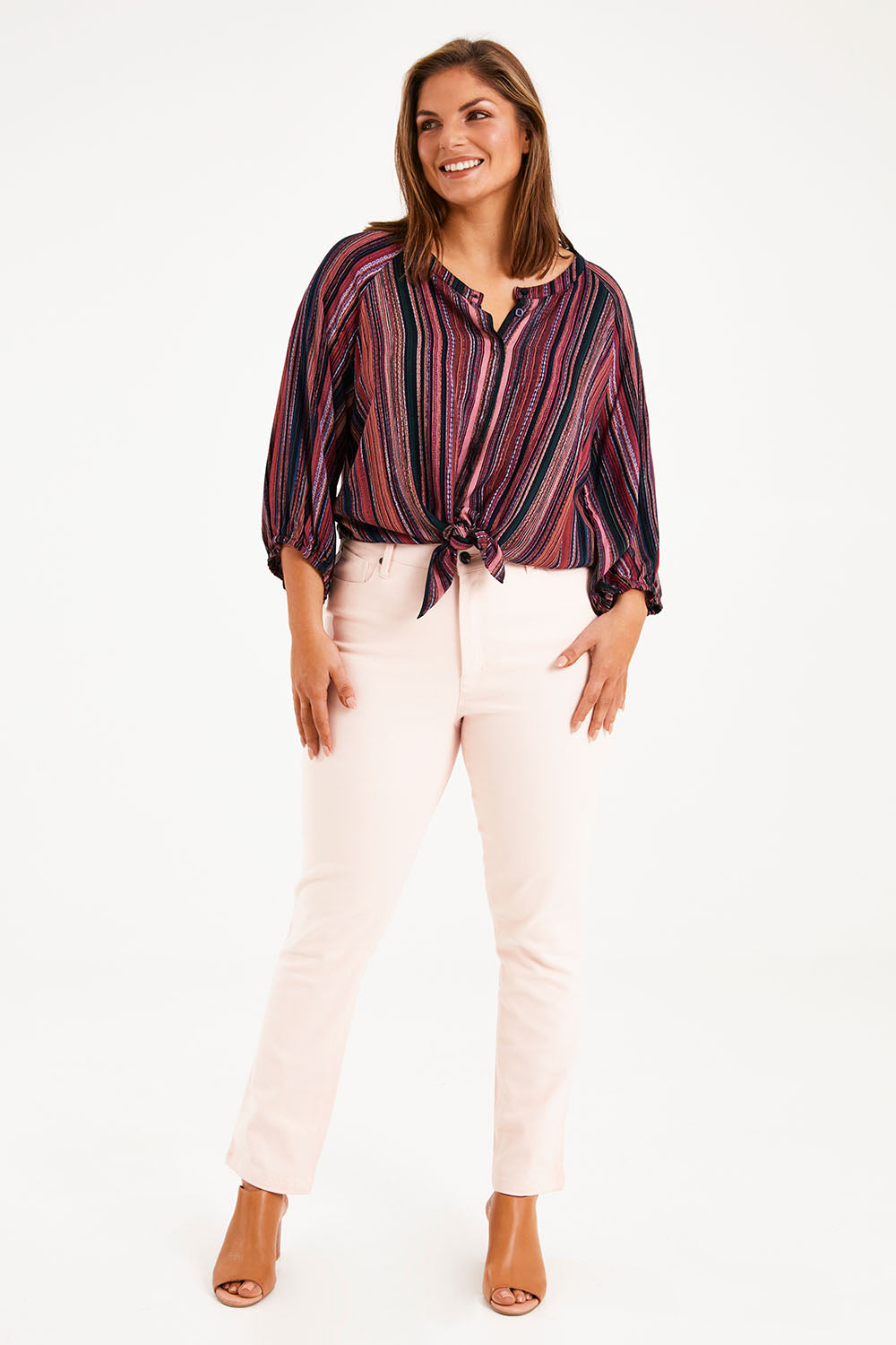 Model Monique wearing size 14 of The Stretch Coloured Denim Jean in colour Fairyfloss (Pink), from the front, showing the whole outfit