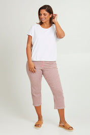 Model Monique wearing size 14 of The Check Pull On Pant in colour Dustyrose (Pink), from the front, showing the whole outfit