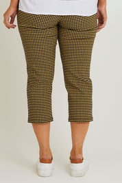 Model Laura wearing size 14 of The Check Pull On Pant in colour Navytan (Blue), from the back