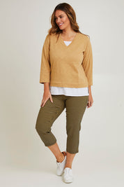 Model Laura wearing size 14 of The Check Pull On Pant in colour Navytan (Blue), from the front, showing the whole outfit