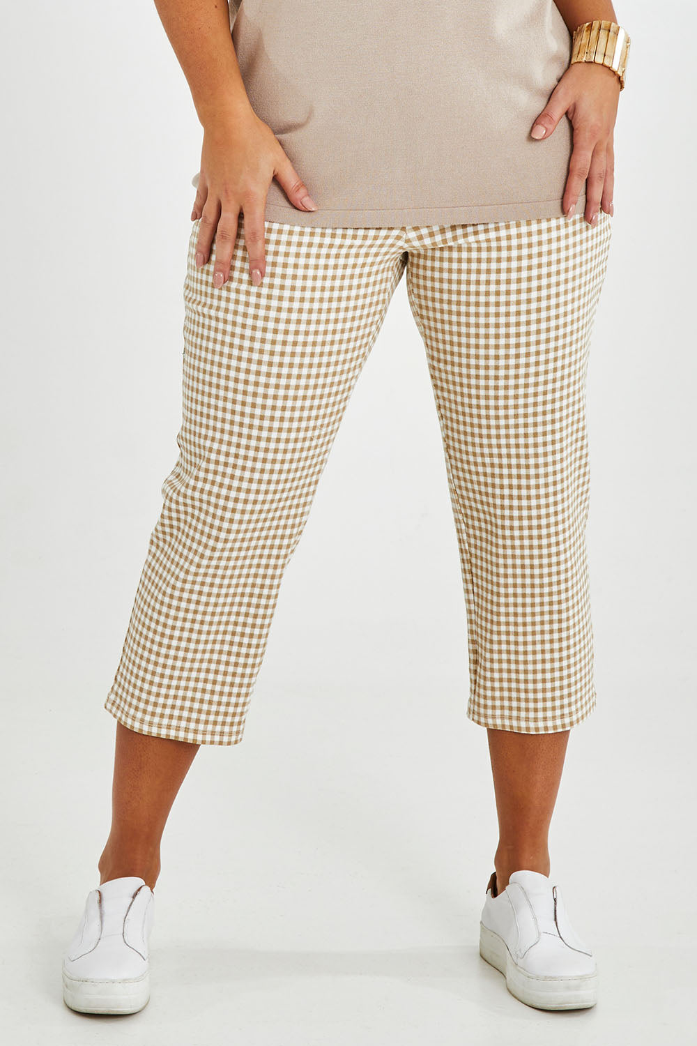 Model Monique wearing size 14 of The Check Pull On Pant in colour Taupewhite, from the front, cropped image
