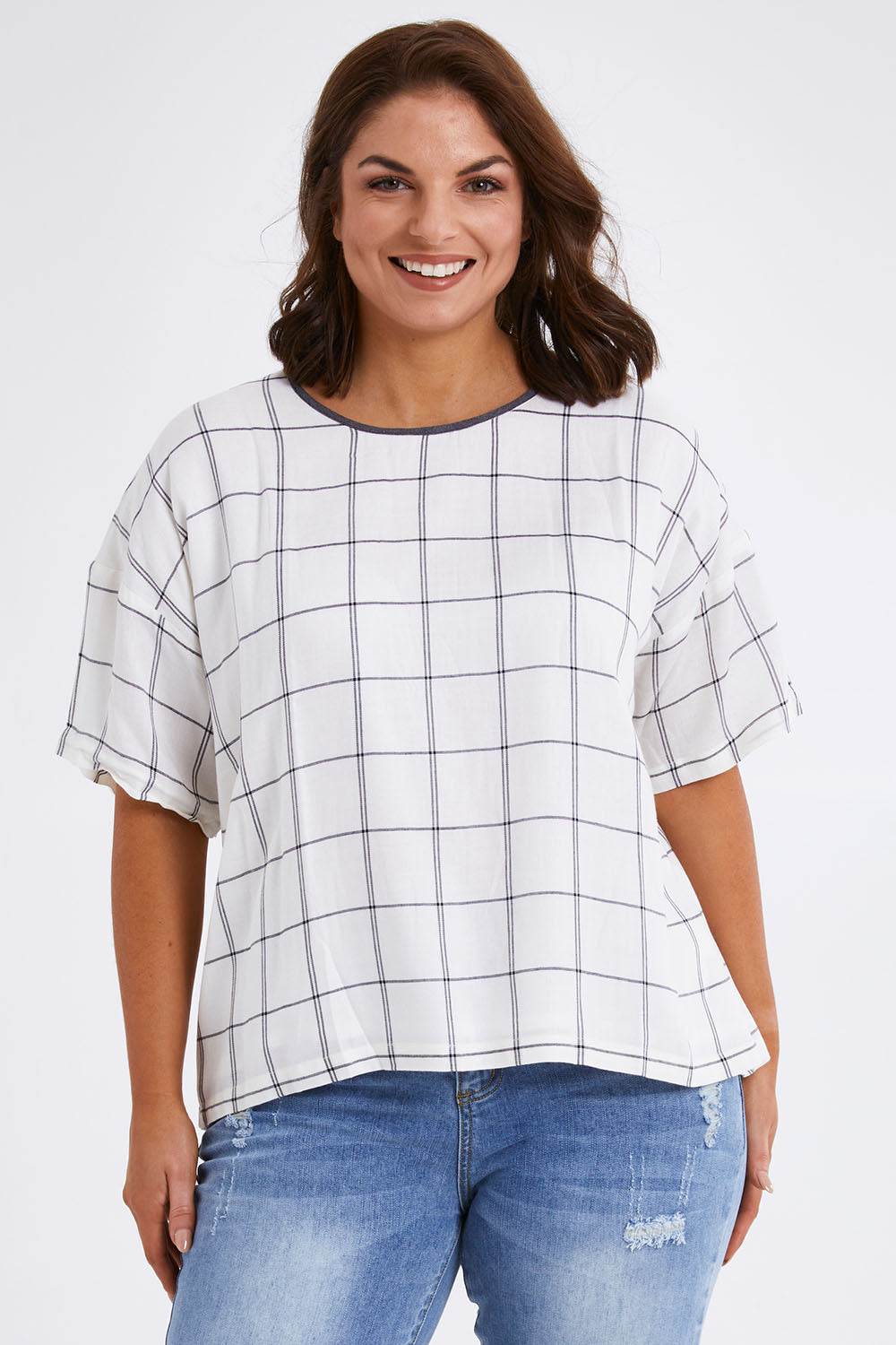 Model Monique wearing size 14 of The Keepers Relax Fit Top in colour Ivorygrey (White), from the front, cropped image