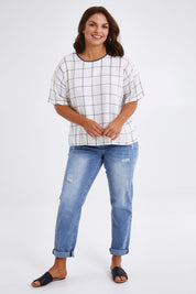Model Monique wearing size 14 of The Keepers Relax Fit Top in colour Ivorygrey (White), from the front, showing the whole outfit