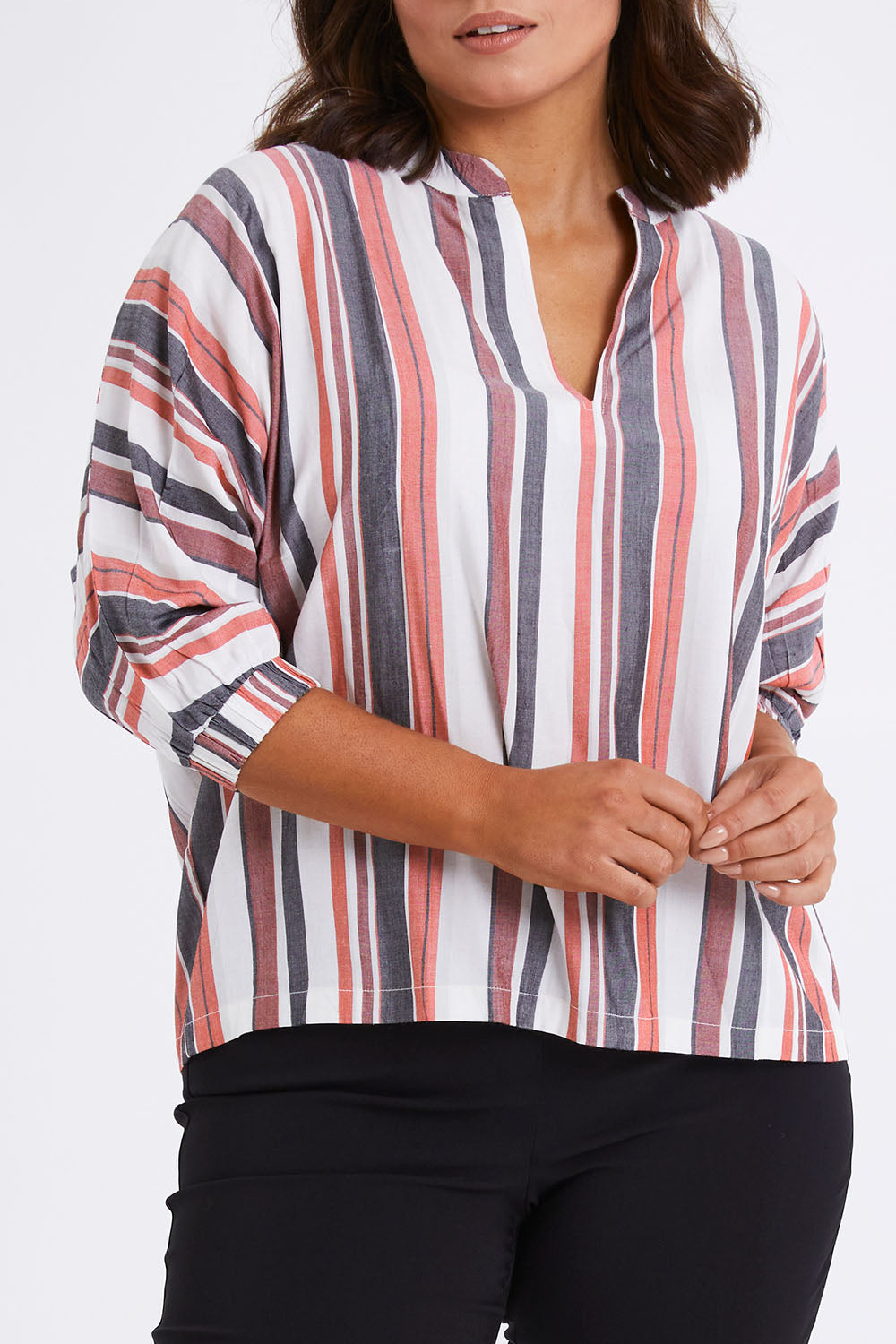 Model Monique wearing size 14 of The Nehru Collar Easy Wear Top in colour Multistrip (Black), from the front, cropped image