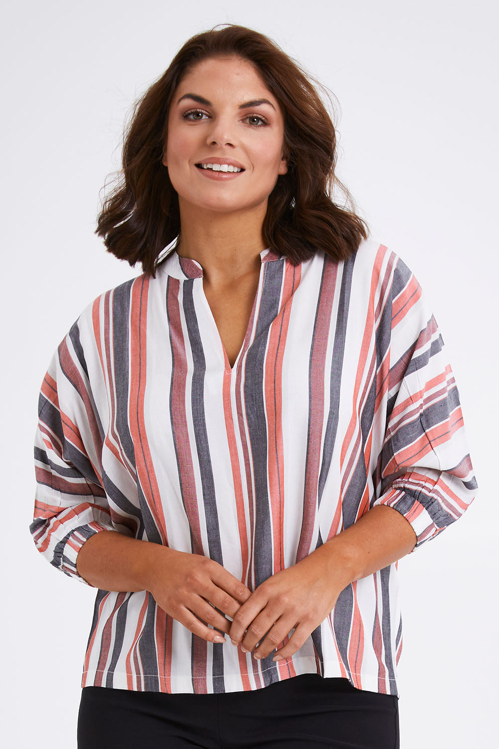 Model Monique wearing size 14 of The Nehru Collar Easy Wear Top in colour Multistrip (Black), from the front, cropped image