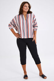 Model Monique wearing size 14 of The X Detail Capri Pant in colour Black (Black), from the front, showing the whole outfit
