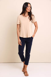 Model Amandam wearing size 10 of the The Bamboo Curved Hem Tee – Almond in colour Almond, from the front