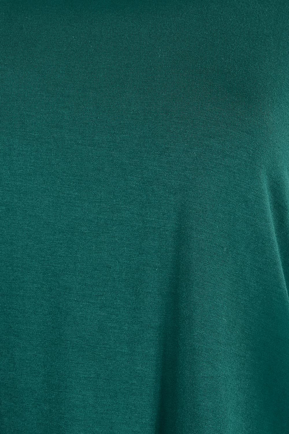Product shot of the The Bamboo Curved Hem Tee – Forest in colour Forest, showing detail