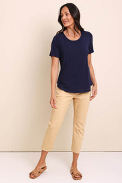 Model Amandam wearing size 10 of the The Bamboo Curved Hem Tee – Navy in colour Navy, from the front