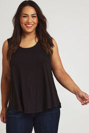 Model Ashleigh wearing size 16 of The Bamboo Crew Neck Swing Tank in colour Black (Black), from the front, cropped image
