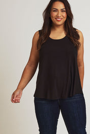 Model Ashleigh wearing size 16 of The Bamboo Crew Neck Swing Tank in colour Black (Black), from the front, showing the whole outfit