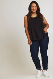 Model Ashleigh wearing size 16 of The Bamboo Crew Neck Swing Tank in colour Black (Black), from the front, showing the whole outfit
