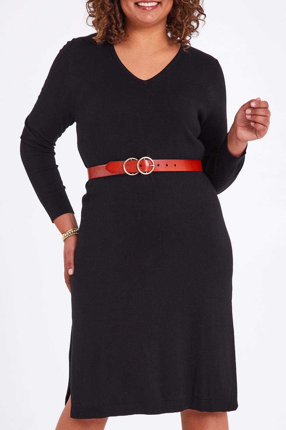 Model Anucia wearing size L of The Transeasonal Knit Dress in colour Black (Black), from the front, cropped image