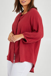 Model Monique wearing size 14 of The Cotton Crew Neck Shirt in colour Chillired (Red), from the front, cropped image