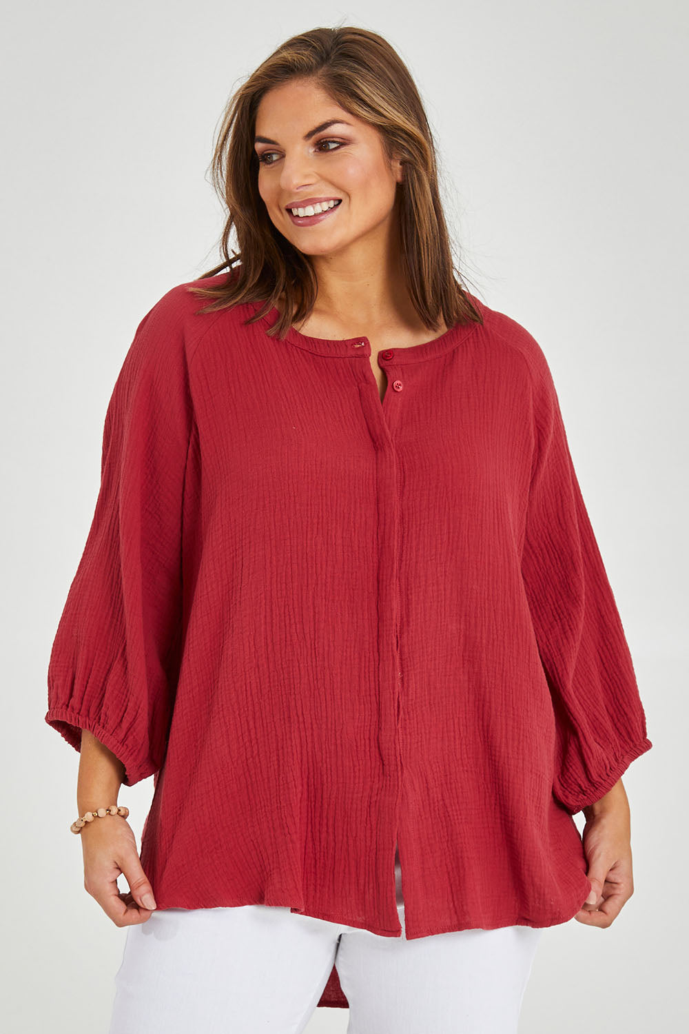 Model Monique wearing size 14 of The Cotton Crew Neck Shirt in colour Chillired (Red), from the front, cropped image