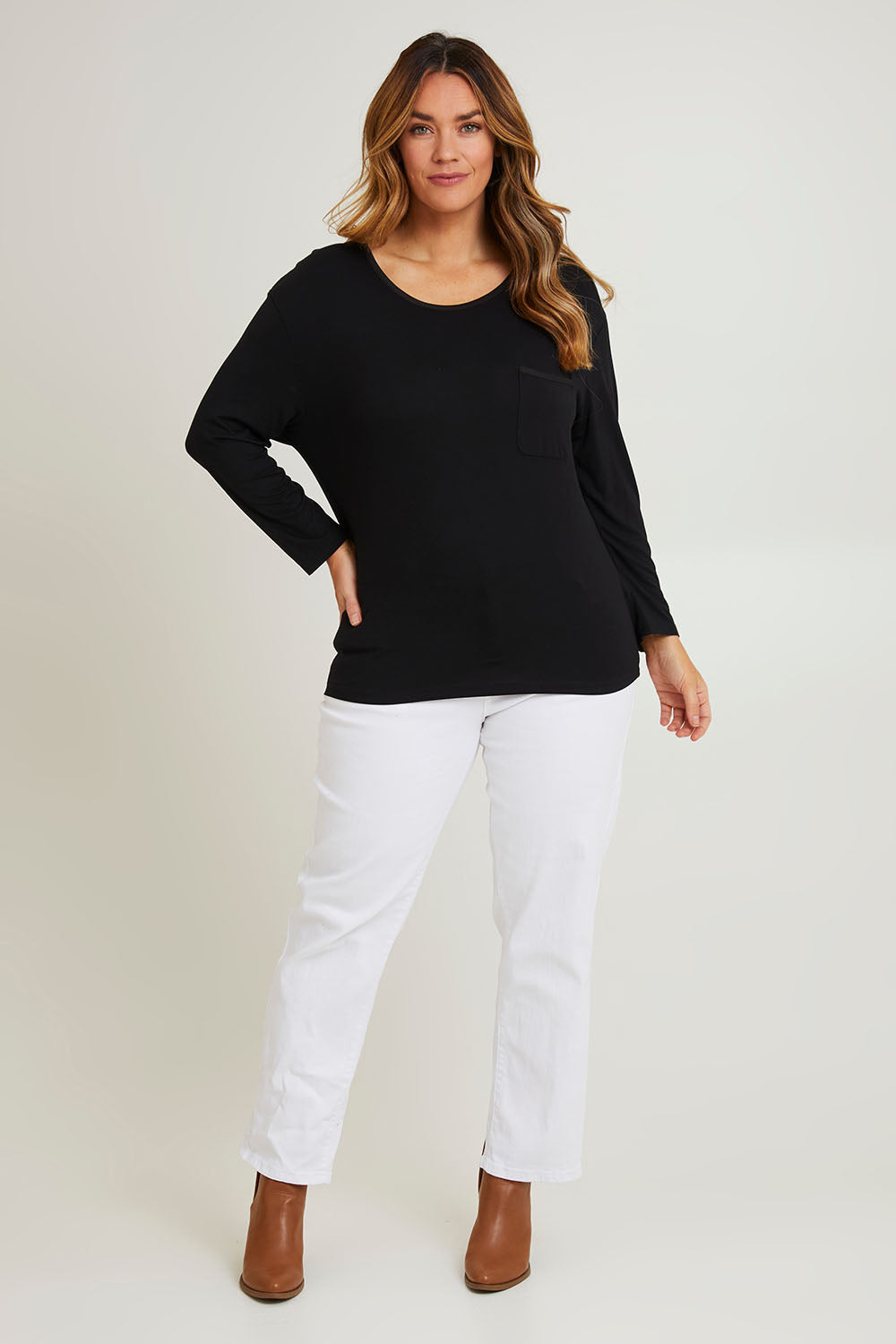 Model Laura wearing size 14 of The Relaxed Satin Bind Tee in colour Black (Black), from the front, showing the whole outfit