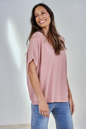 Model Amanda wearing size S of The Relaxed V Neck Knit Tee in colour Blushcandy (Pink), from the front, showing the whole outfit