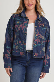 Model Chanel wearing size 16 of The Keepers Printed Denim Jacket in colour Redfloral (Blue), from the front, cropped image