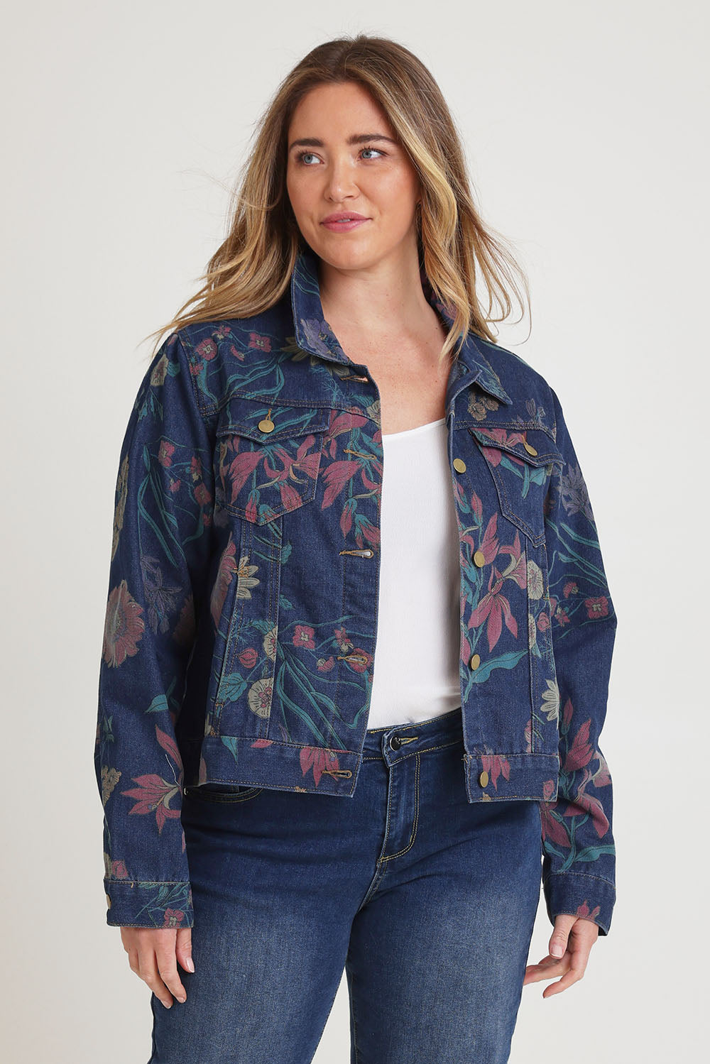 Model Chanel wearing size 16 of The Keepers Printed Denim Jacket in colour Redfloral (Blue), from the front, cropped image