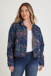 Model Chanel wearing size 16 of The Keepers Printed Denim Jacket in colour Redfloral (Blue), from the front, cropped image