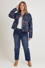 Model Chanel wearing size 16 of The Keepers Printed Denim Jacket in colour Redfloral (Blue), from the front, showing the whole outfit