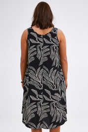 Model Monique wearing size 14 of The Printed High Low Dress in colour Blackwhite (Black), from the back