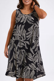 Model Monique wearing size 14 of The Printed High Low Dress in colour Blackwhite (Black), from the front, cropped image
