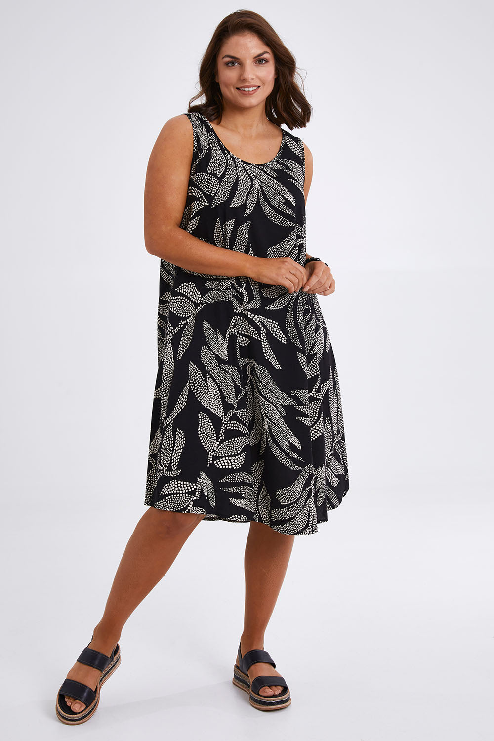 Model Monique wearing size 14 of The Printed High Low Dress in colour Blackwhite (Black), from the front, showing the whole outfit