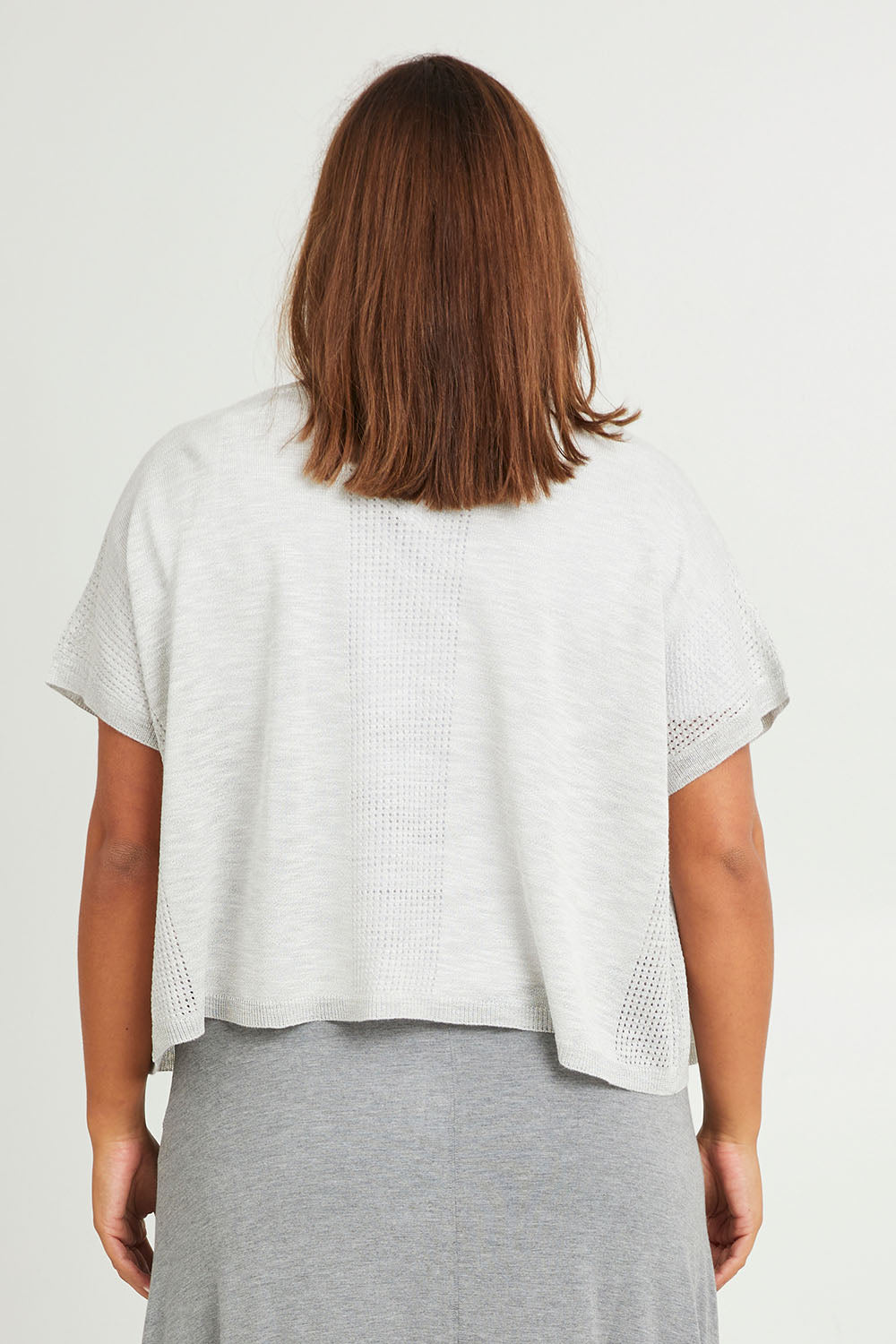 Model Monique wearing size L of The Short Sleeve Shrug in colour Greymarle (Grey), from the back