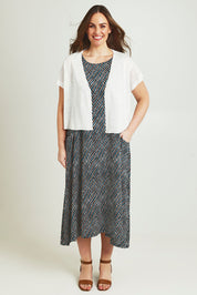 Model Jane wearing size L of The Short Sleeve Shrug in colour White (White), from the front, showing the whole outfit