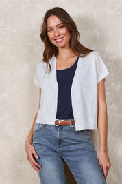 Model Madeline wearing size S of The Short Sleeve Shrug in colour White (White), from the front, showing the whole outfit
