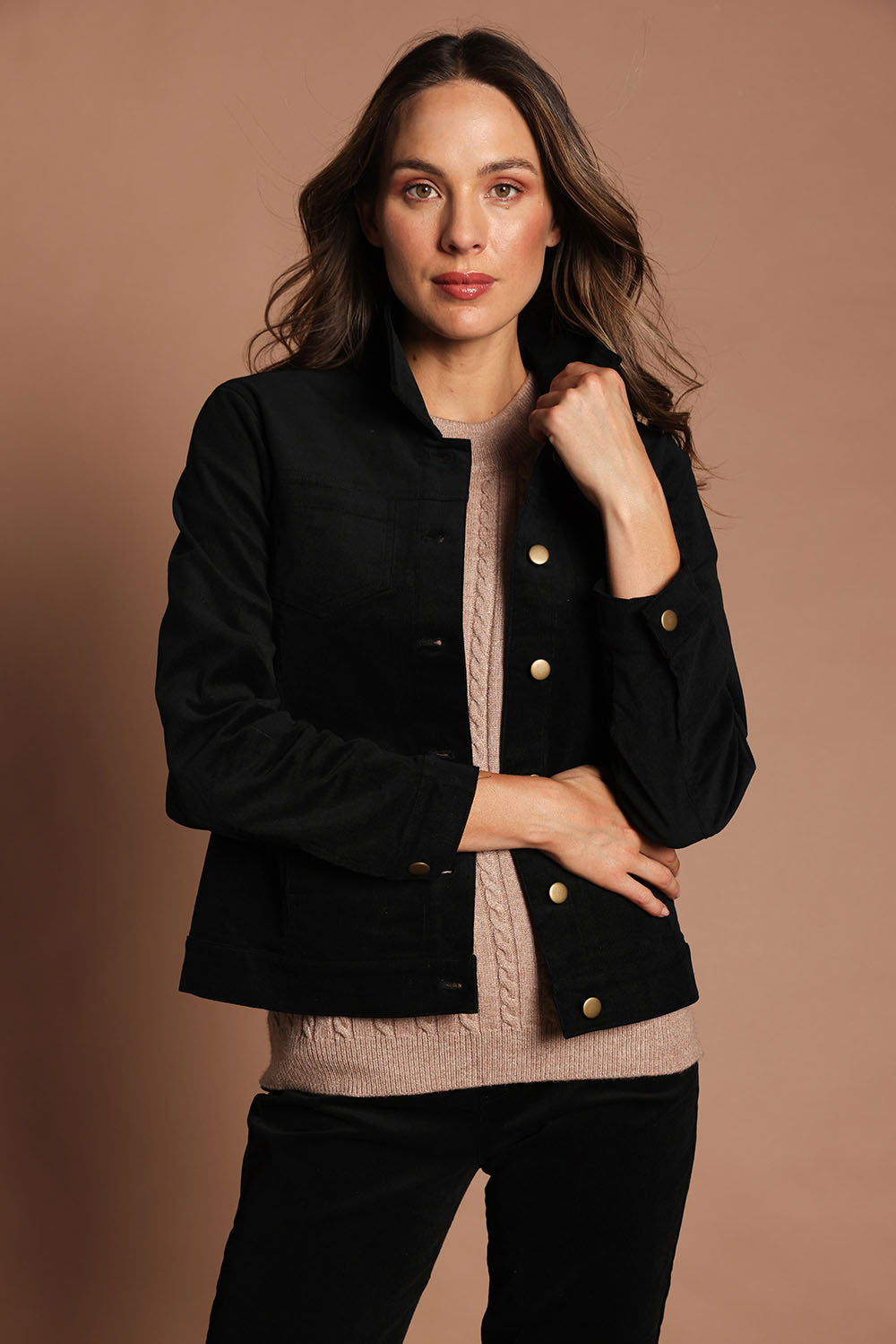 Model Madeline wearing size 10 of The Keepers Cord Jacket in colour Black (Black), from the front, showing the whole outfit