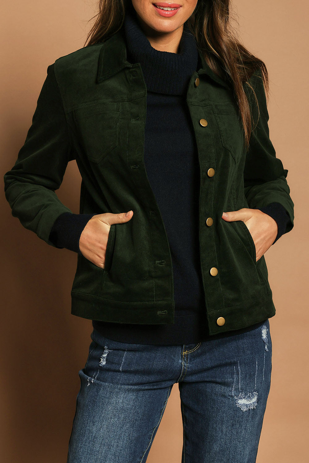 Model Madeline wearing size 10 of The Keepers Cord Jacket in colour Deepforest (Green), from the front, cropped image