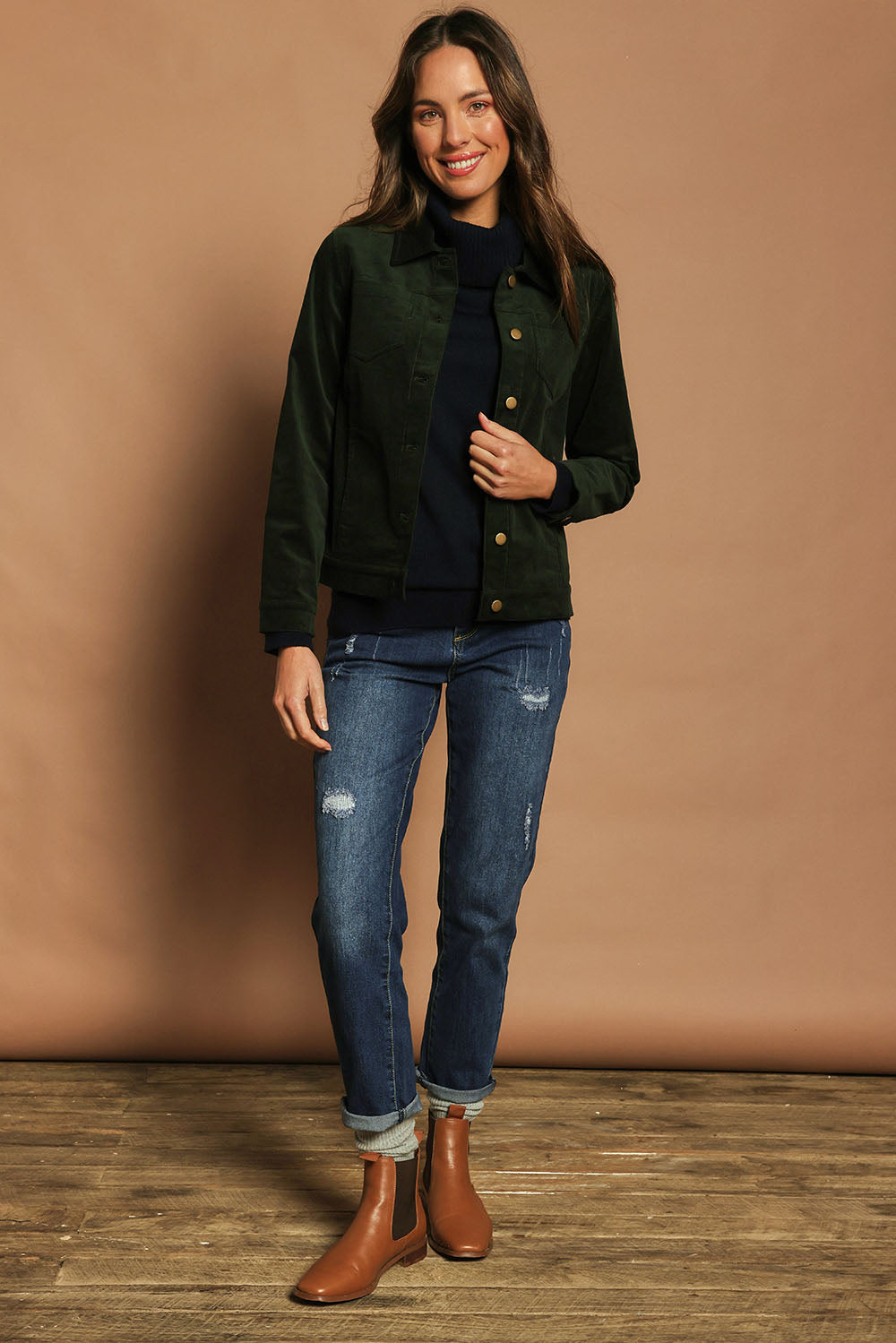 Model Madeline wearing size 10 of The Keepers Cord Jacket in colour Deepforest (Green), from the front, showing the whole outfit