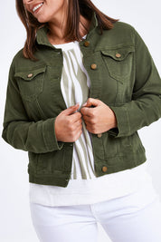 Model Monique wearing size 14 of The Slim Fit Denim Jacket in colour Khaki (Green), from the front, cropped image