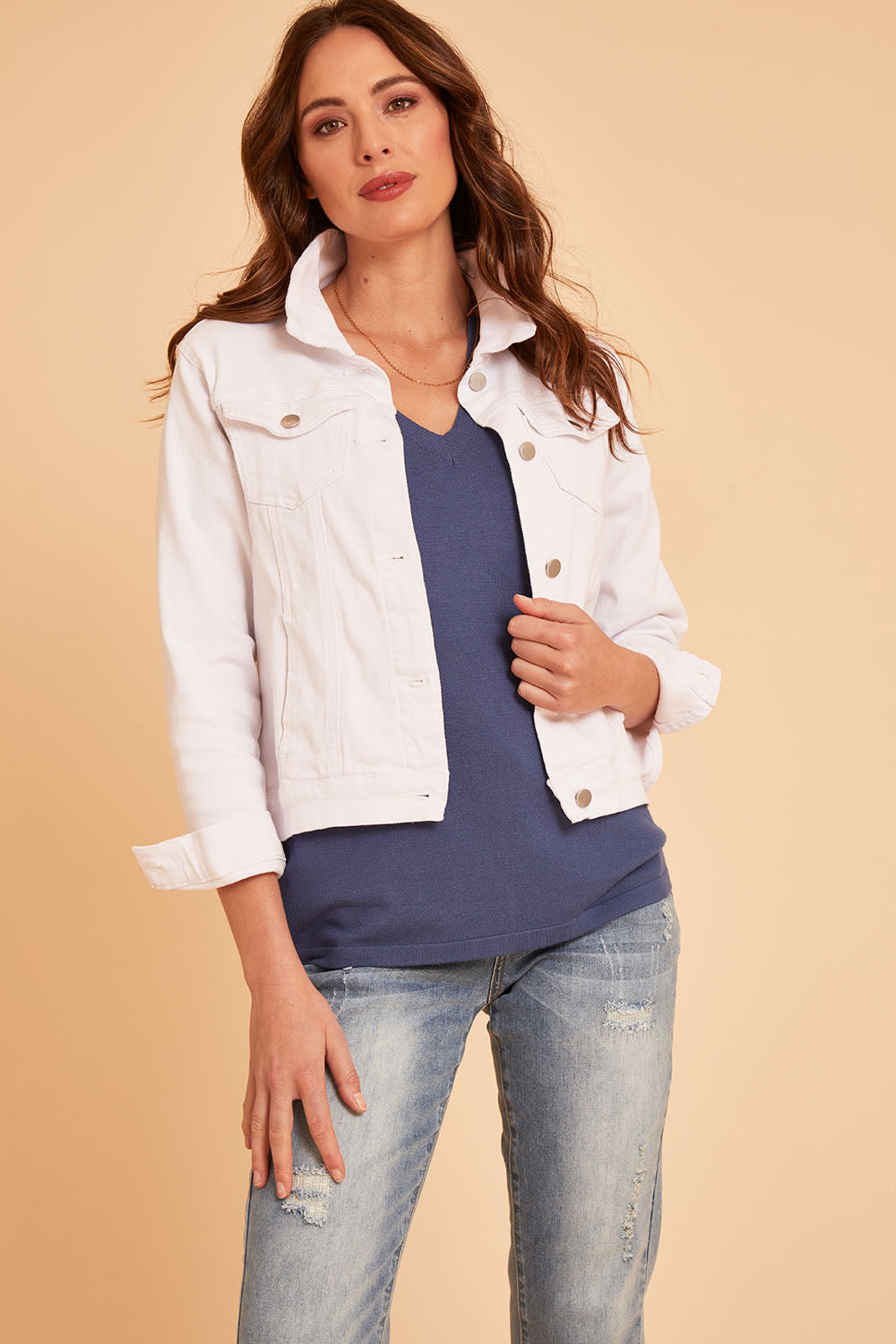 Model Madeline wearing size 10 of The Slim Fit Denim Jacket in colour White (White), from the front, cropped image